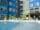 A swimming pool in an apartment complex.